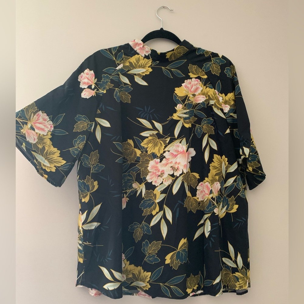 Floral blouse with keyhole button back.